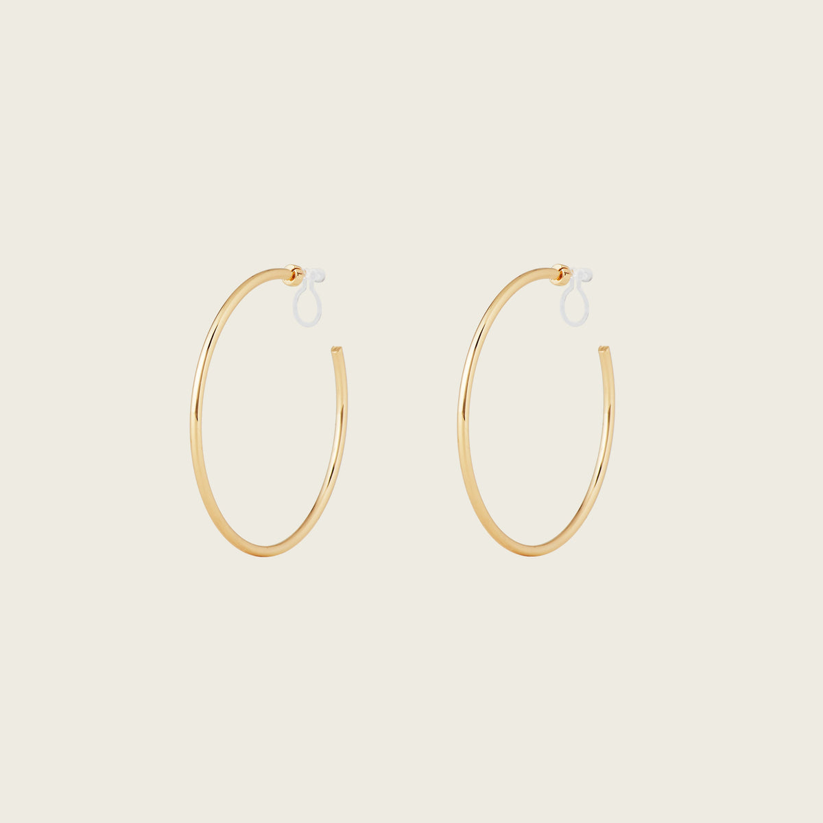 https://cdn.shopify.com/s/files/1/0569/3286/0096/files/LargeThinHoopsinGold_901c09bc-84a7-42b3-8bd3-203fb58c4d50.jpg?v=1754462432