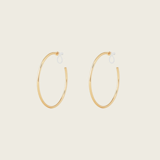 https://cdn.shopify.com/s/files/1/0569/3286/0096/files/LargeThinHoopsinGold_901c09bc-84a7-42b3-8bd3-203fb58c4d50.jpg?v=1754462432