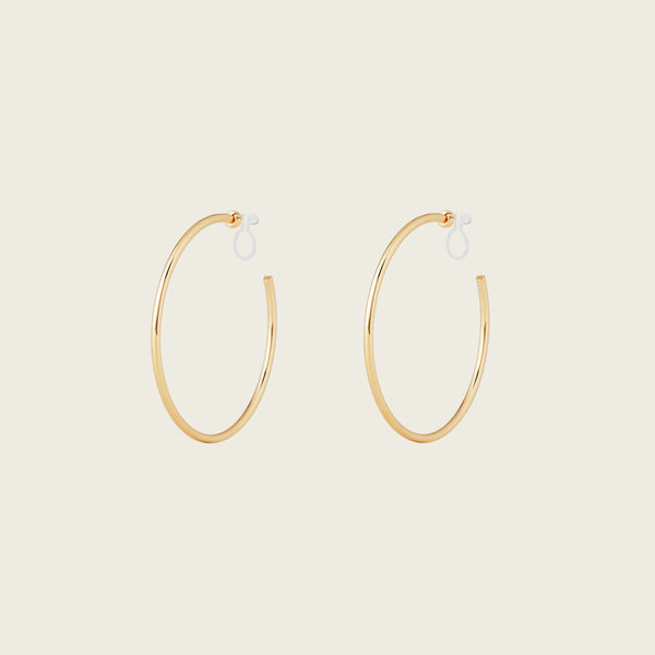https://cdn.shopify.com/s/files/1/0569/3286/0096/files/LargeThinHoopsinGold_901c09bc-84a7-42b3-8bd3-203fb58c4d50.jpg?v=1754462432